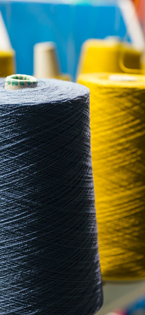 Industrial textile manufacturing of recycled-yarn fleece