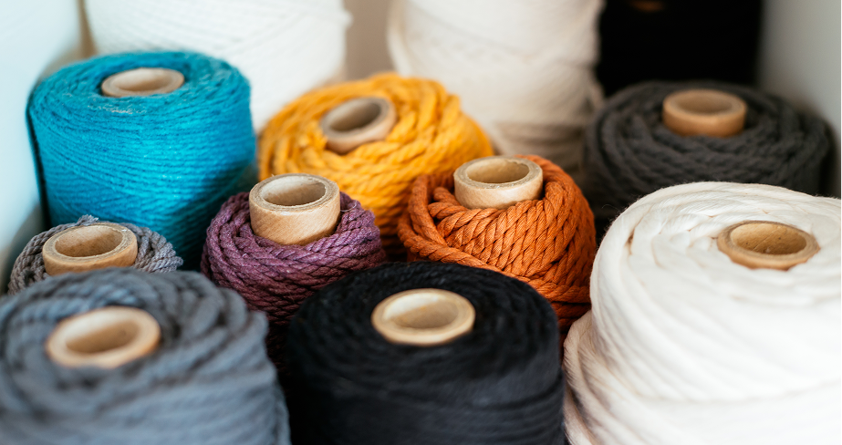 Yarn cones on a creel in a modern spinning production line